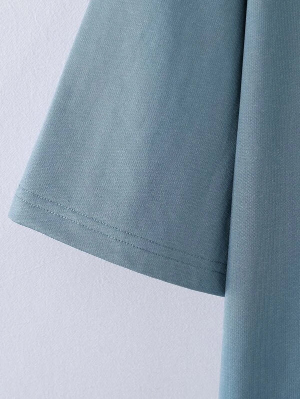 6719 a03-03 Polo oversize con estampado de slogan
