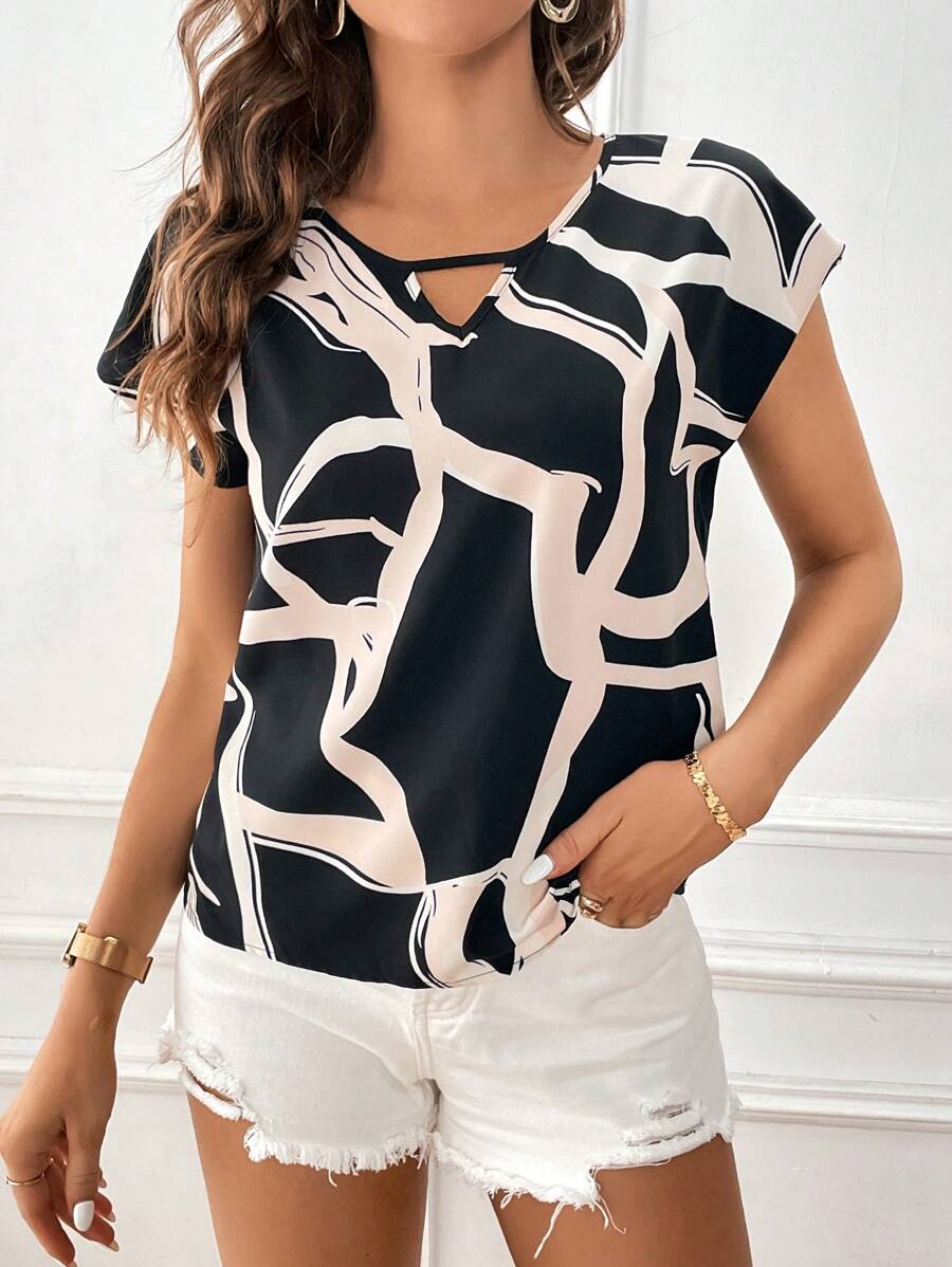 9224 1a-04-04 Blusa con estampado de dibujo de cuello con abertura de ojo de manga murciélago