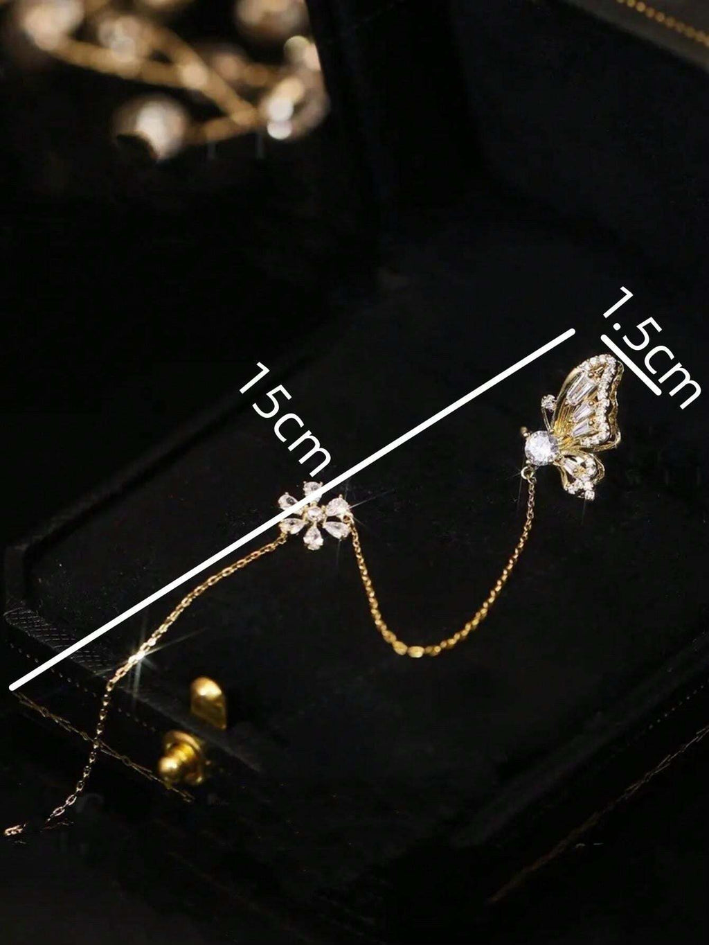7836 1b-052 Un pendiente en forma de mariposa para mujer