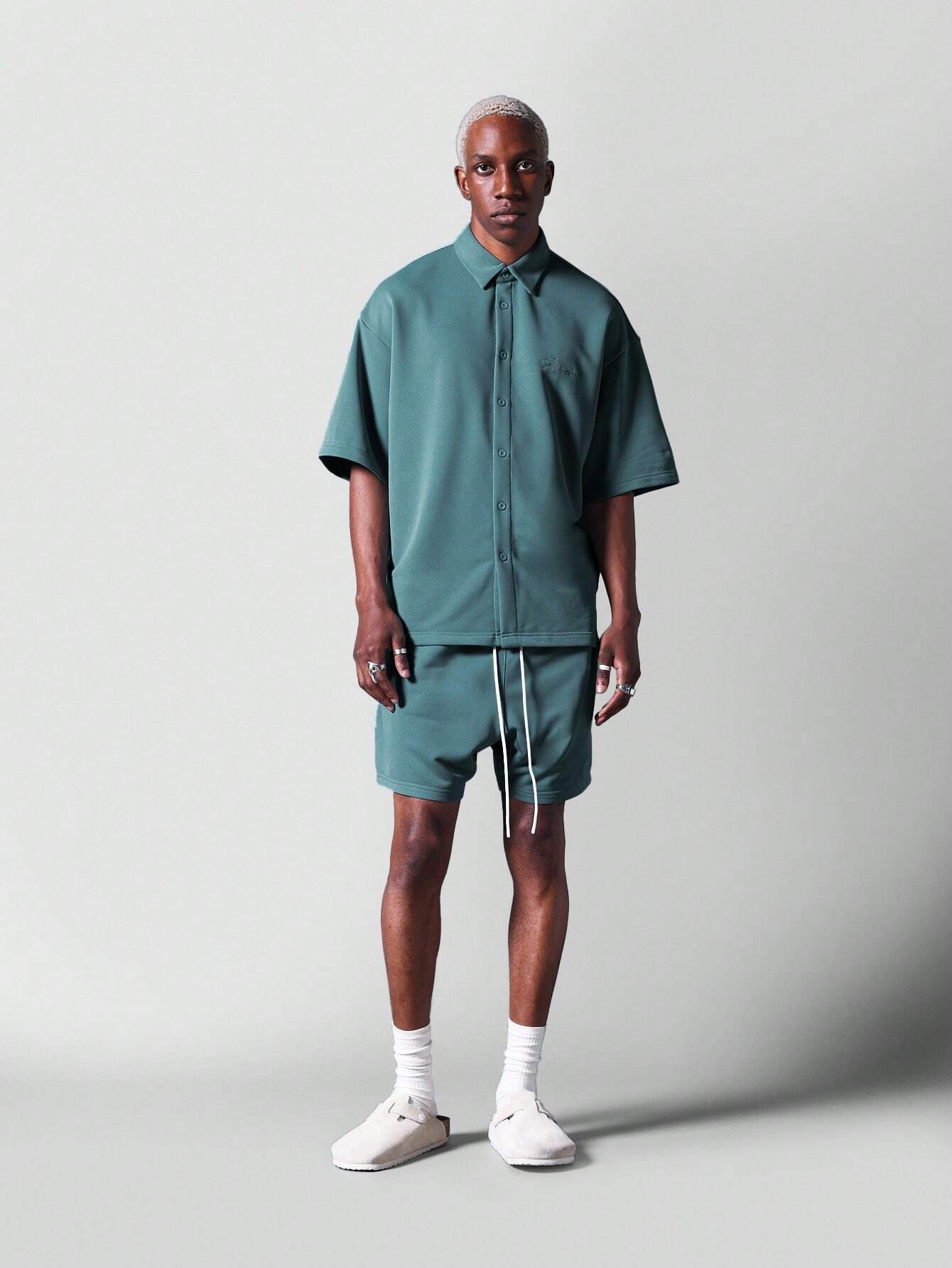 13799 1t-006 Camisa 1 pieza oversize de punto con logo bordado