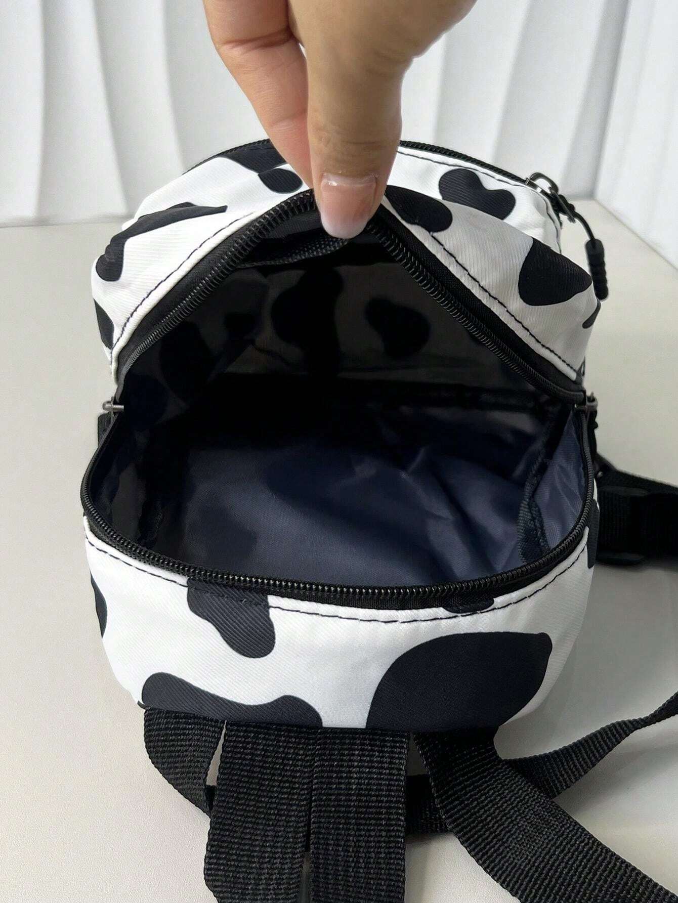 9975 1c-01-02  Mochila mini clásica de lona con patrón de vaca