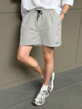 13810 1t-012 Shorts casuales holgados para hombre con cintura de cordón