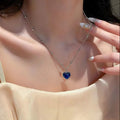 17239 1b-012 Collar con dije de corazón azul 1 Pza